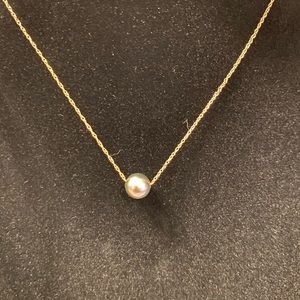 Black Pearl on thin 14 carat 16” chain. Spring clasp.